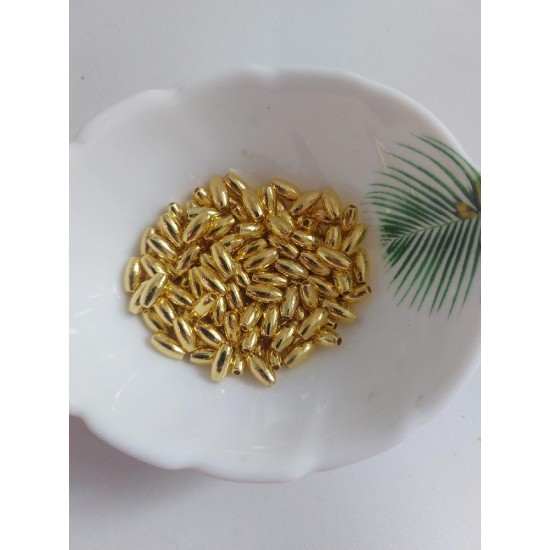 Бусины под жемчуг "рис" 4*8 мм золото, цена за 10 гр