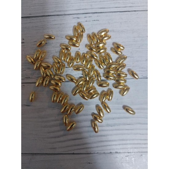 Бусины под жемчуг "рис" 4*8 мм золото, цена за 10 гр